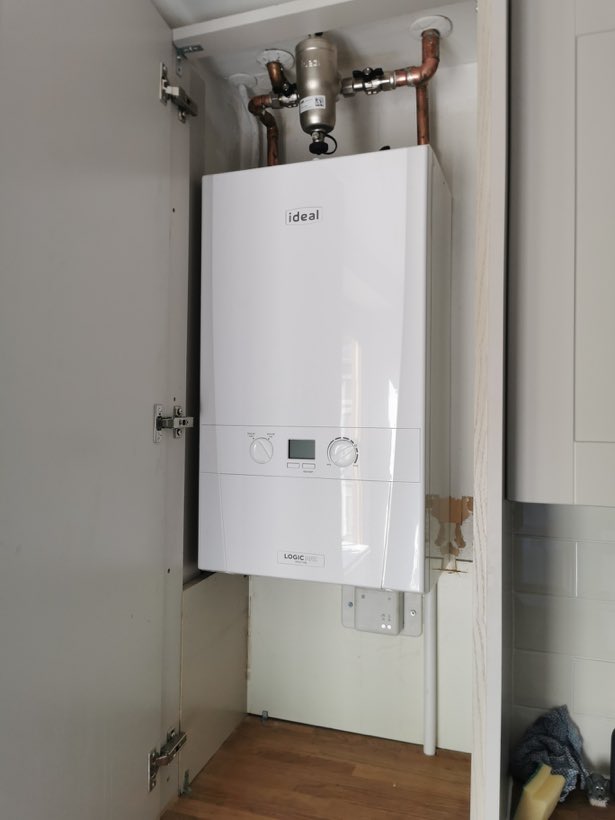 Ideal Logic Max boiler fitted inside a kitchen cupboard